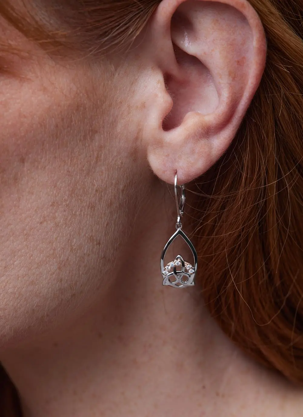 Close up shot of red haired model wearing Sterling Silver 